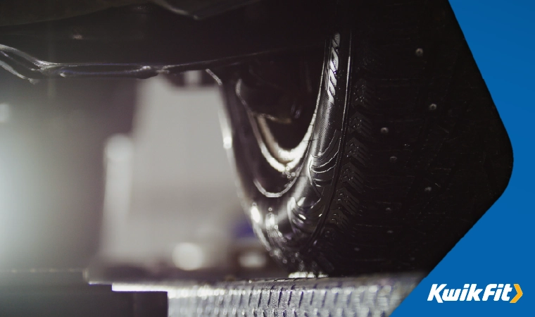 Car on a ramp ready for wheel aligment